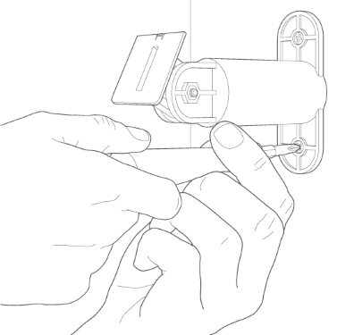 Screwing the mounting base onto wall.