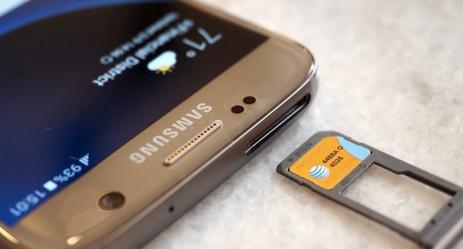 The top of an android device showing the SIM card slot and the sim card removed