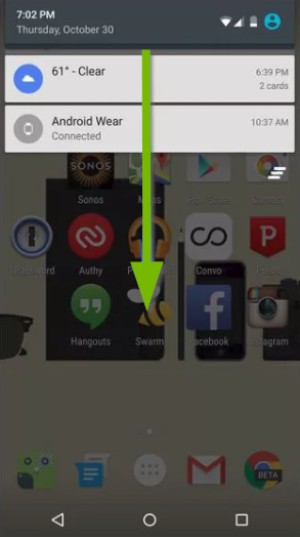 Screen with arrow pointing down indicating for you to swipe down from the top of the screen with your finger