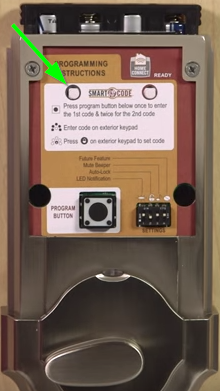 The back of a kwikset lock with an arrow pointing to the A button