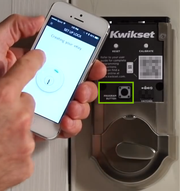 Picture of phone on setup screen and inside of lock with program button highlighted