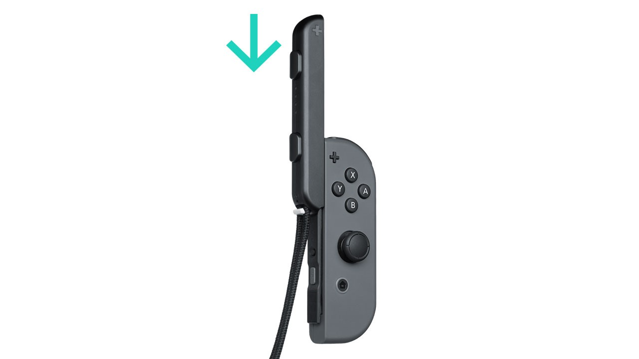 Nintendo Joy-Con with strap being pushed down