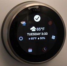 Nest thermostat displaying the quick menu.