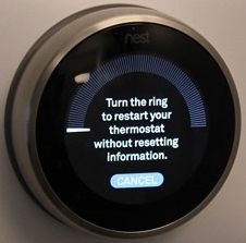 Nest thermostat reset prompting the user to turn the dial to confirm their choice.