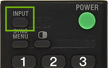 TV remote with input button highlighted