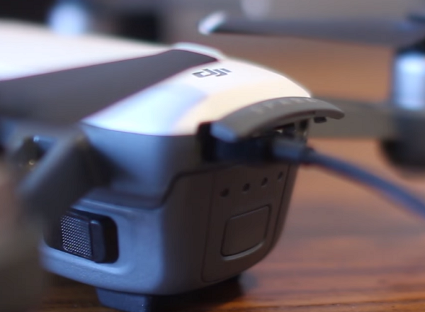 DJI drone with cable plugged in