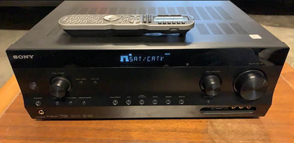 AV receiver powered on to a cable TV input. Illustration.