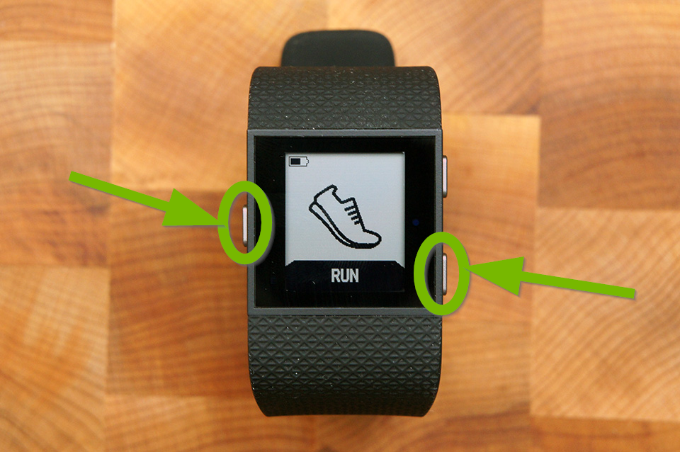 Fitbit Surge with Home and Select buttons highlighted.