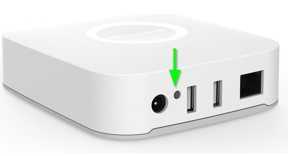 The back of a Smartthings Hub with an arrow pointing at the button