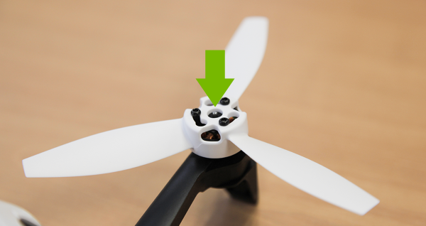 Arrow pointing at protruding axle of drone motor.