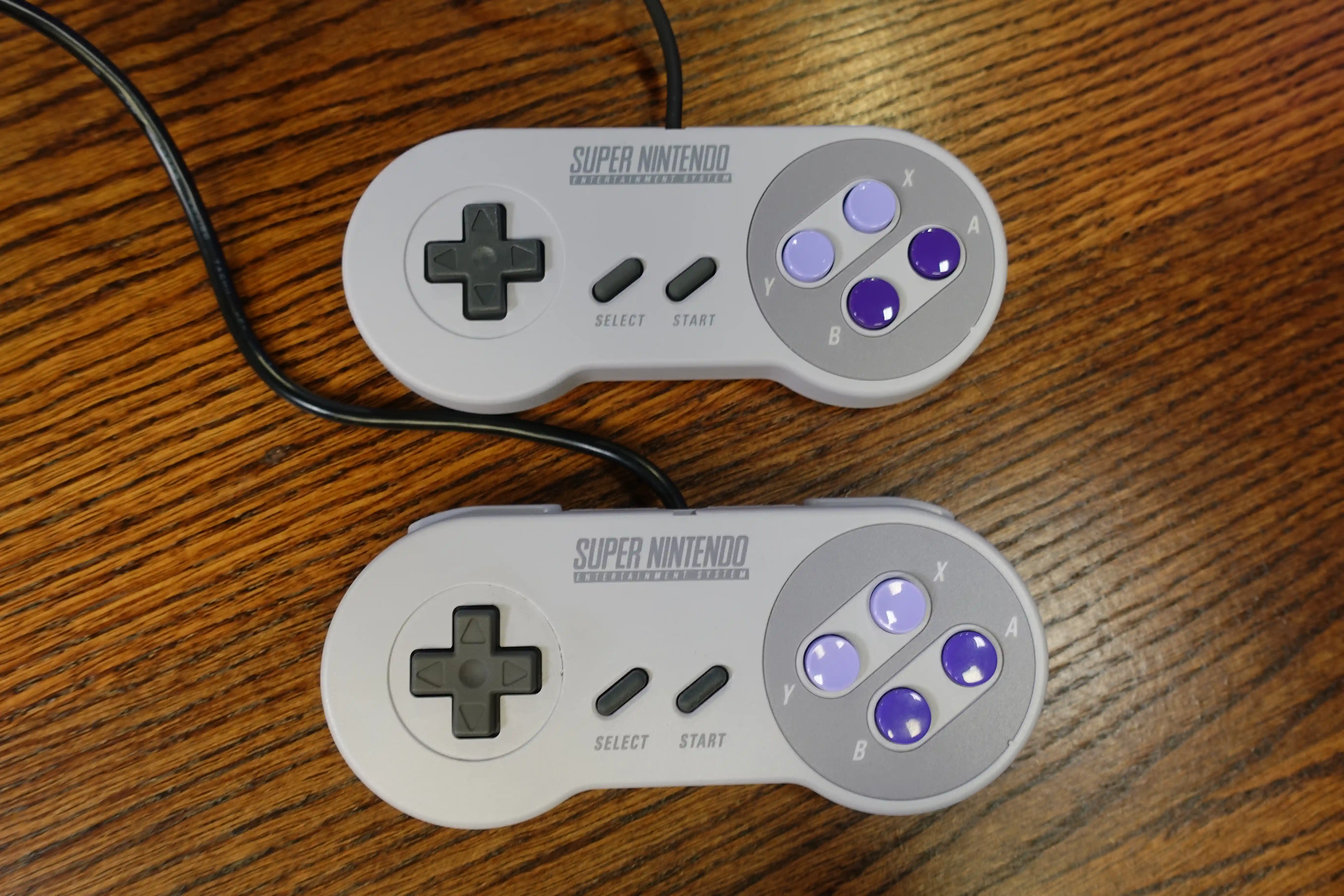 Photo of the two supplied controllers that come packaged with the SNES Classic Edition.