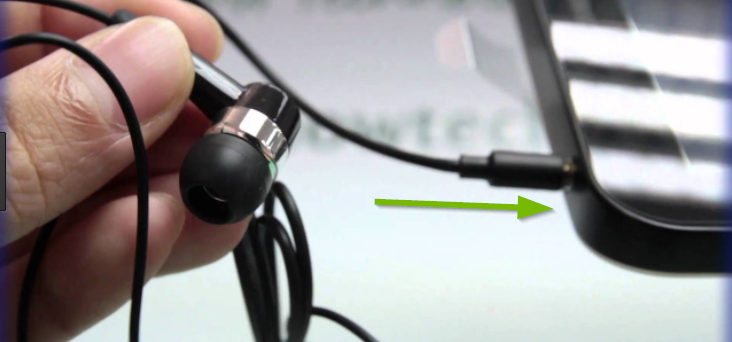 Earbuds with jack being shown connecting