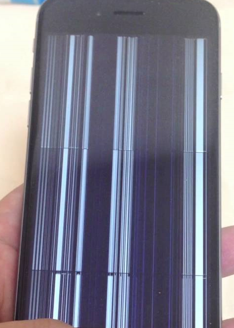 iPhone with black screen and white lines that is clearly damaged