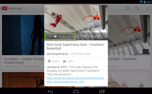 YouTube app displaying a video's informational screen highlighting the play button.