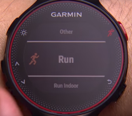 Garmin Forerunner with red runner button pressed