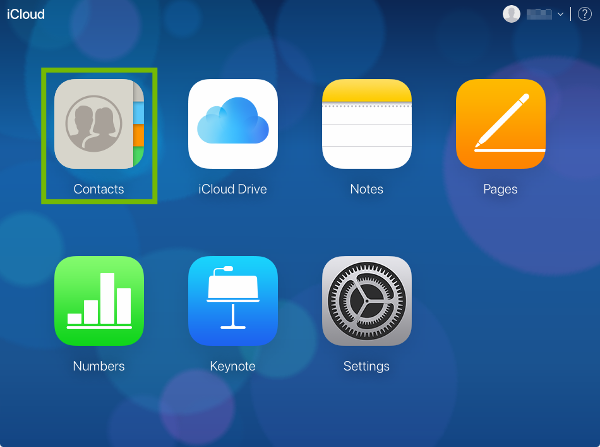 iCloud desktop page with Contacts highlighted.