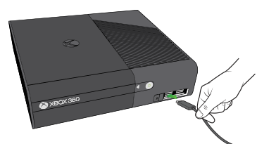 Xbox 360 console showing usb being plugged in