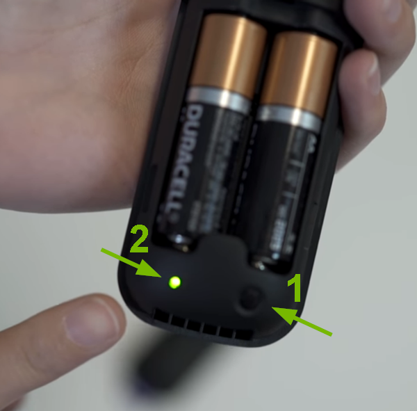 Pairing button and light pointed out on Roku remote.