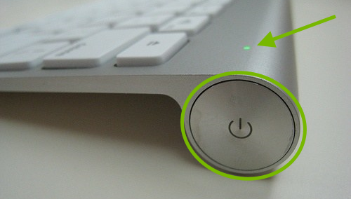 Power button highlighted and LED pointed out on Apple Wireless Keyboard.