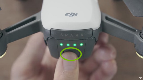 Drone with power button highlighted. Illustration