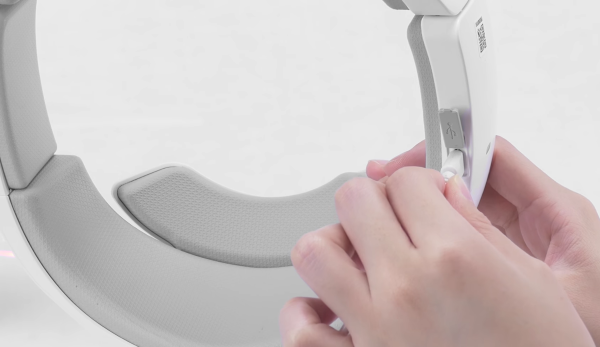 Micro USB cable being plugged into goggles headband.