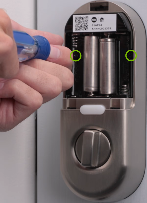 Bolt holes annotated on door lock.