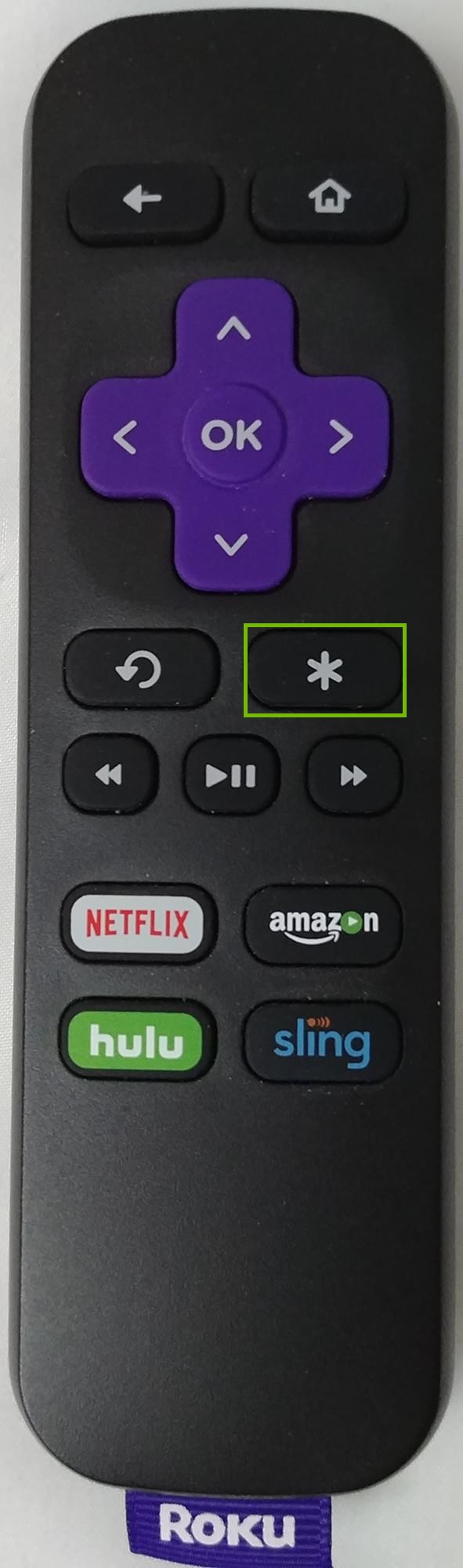 Roku TV remote highlighting the option button.