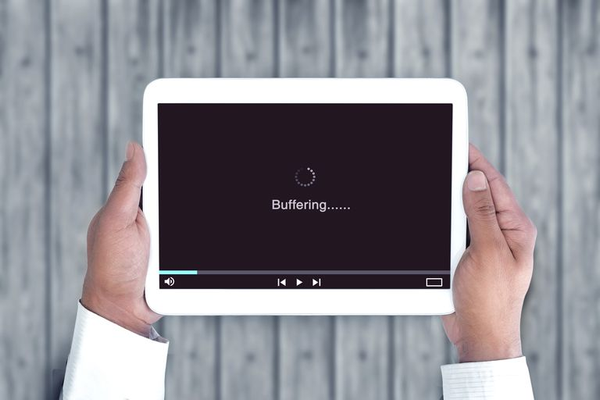 Tablet displaying a buffering message.