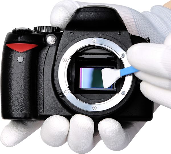 DSLR camera sensor being cleaned.