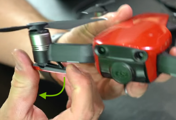 Arrow showing landing gear unfolding direction.