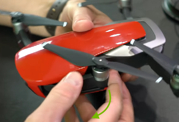 Arrow showing front arm unfolding direction.