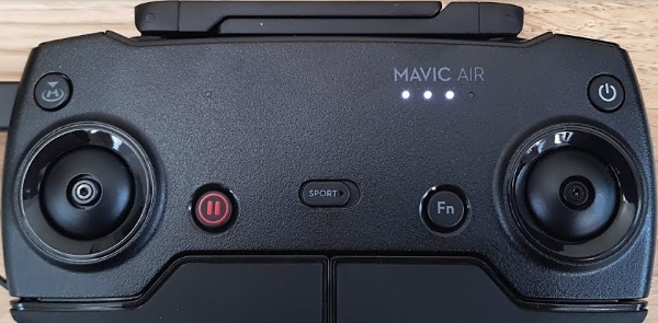 Remote control lights showing charging progress.