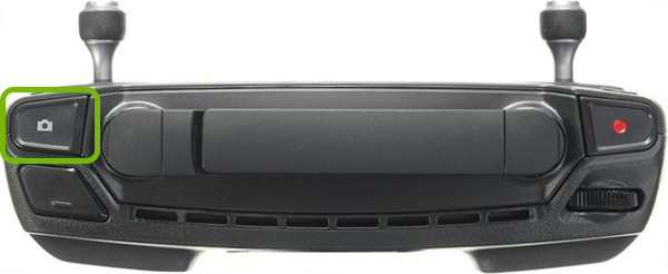 Shutter button highlighted on front of remote control.