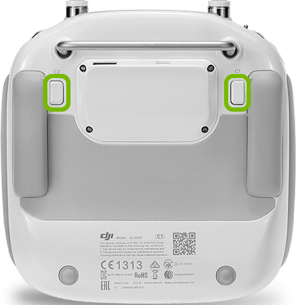 Customizable buttons highlighted on back of remote control.