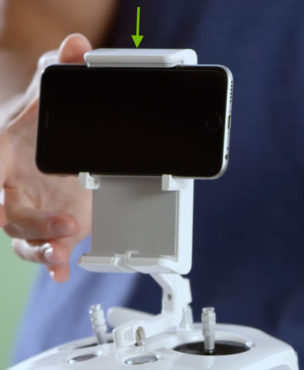 Arrow showing  closing of the holder clamp.