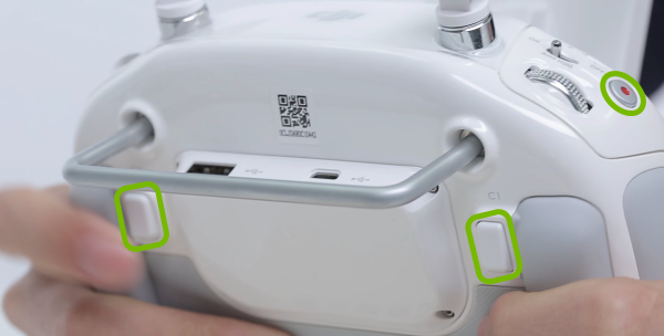 Linking buttons highlighted on remote control.