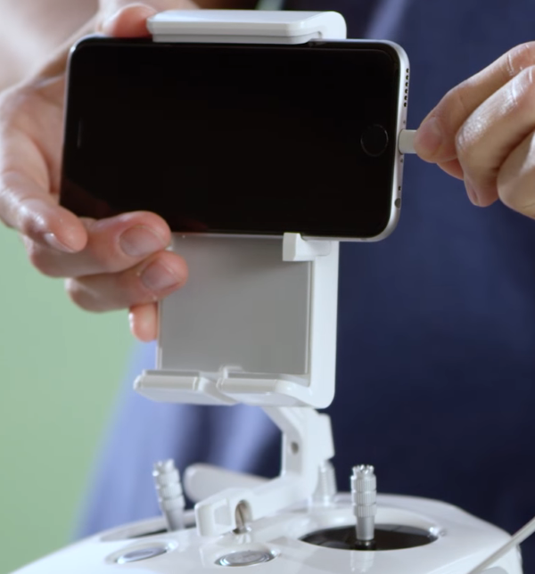 USB cable being plugged into mobile device.