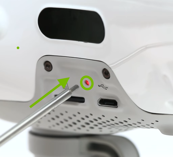 Link button highlighted on side of drone.