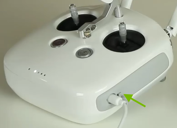 Charging cable connected to remote control.