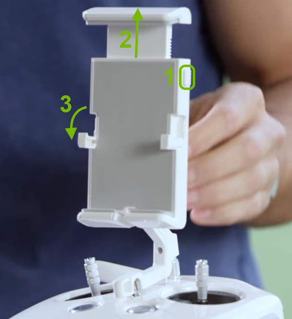 Release button highlighted and arrows showing how to extend holder and unfold supporting arms.