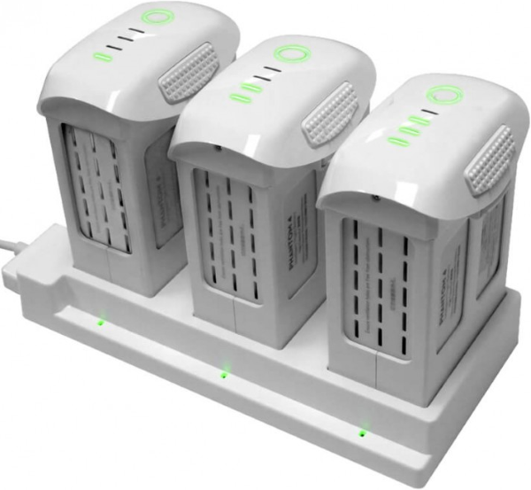 Drone batteries plugged into charging hub.
