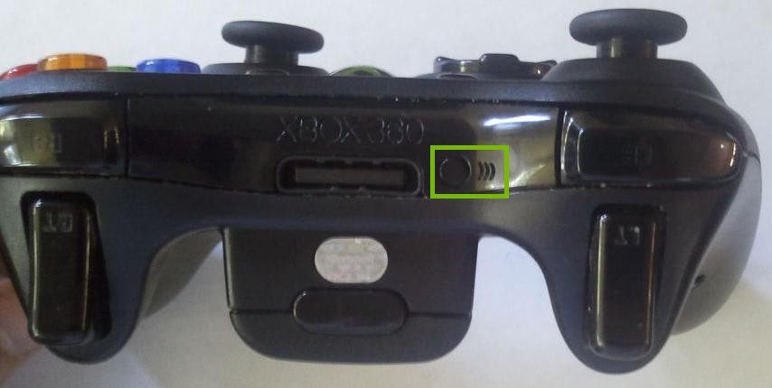 Xbox 360 wireless controller highlighting the controller sync button.