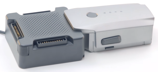 Drone battery plugged in to charging hub.