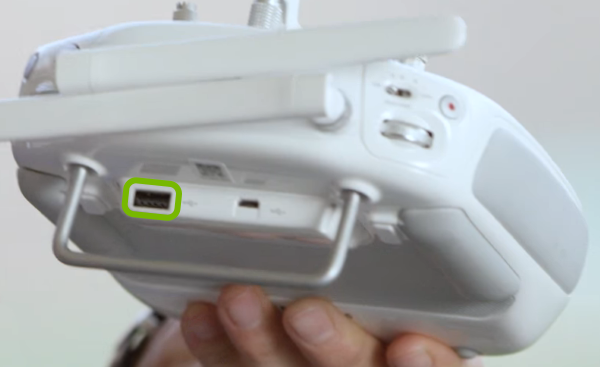 USB port highlighted on rear of remote control.