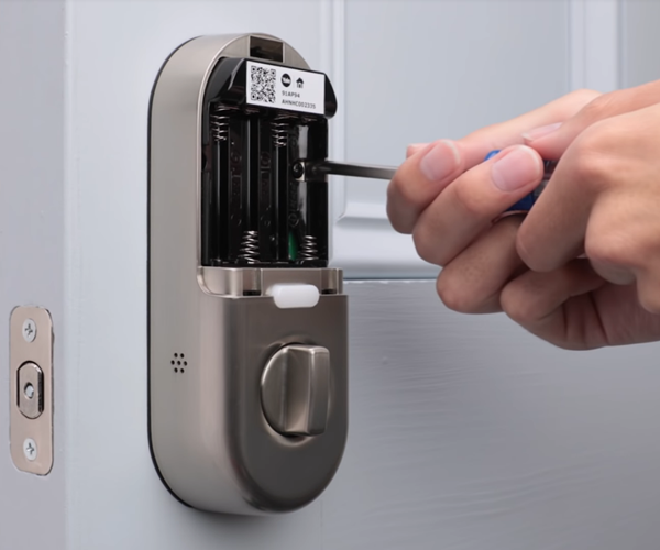 Mounting the lock onto the plate. Illustration.