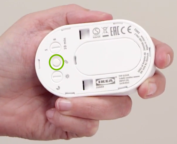 Link button highlighted on back of motion sensor.