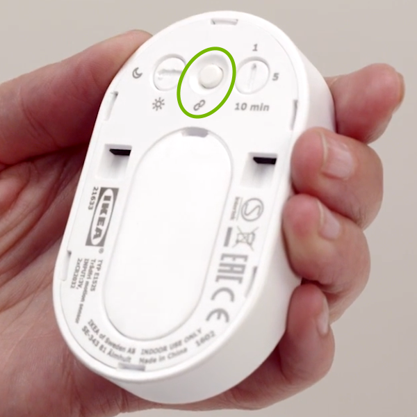 Link button highlighted on back of motion sensor.