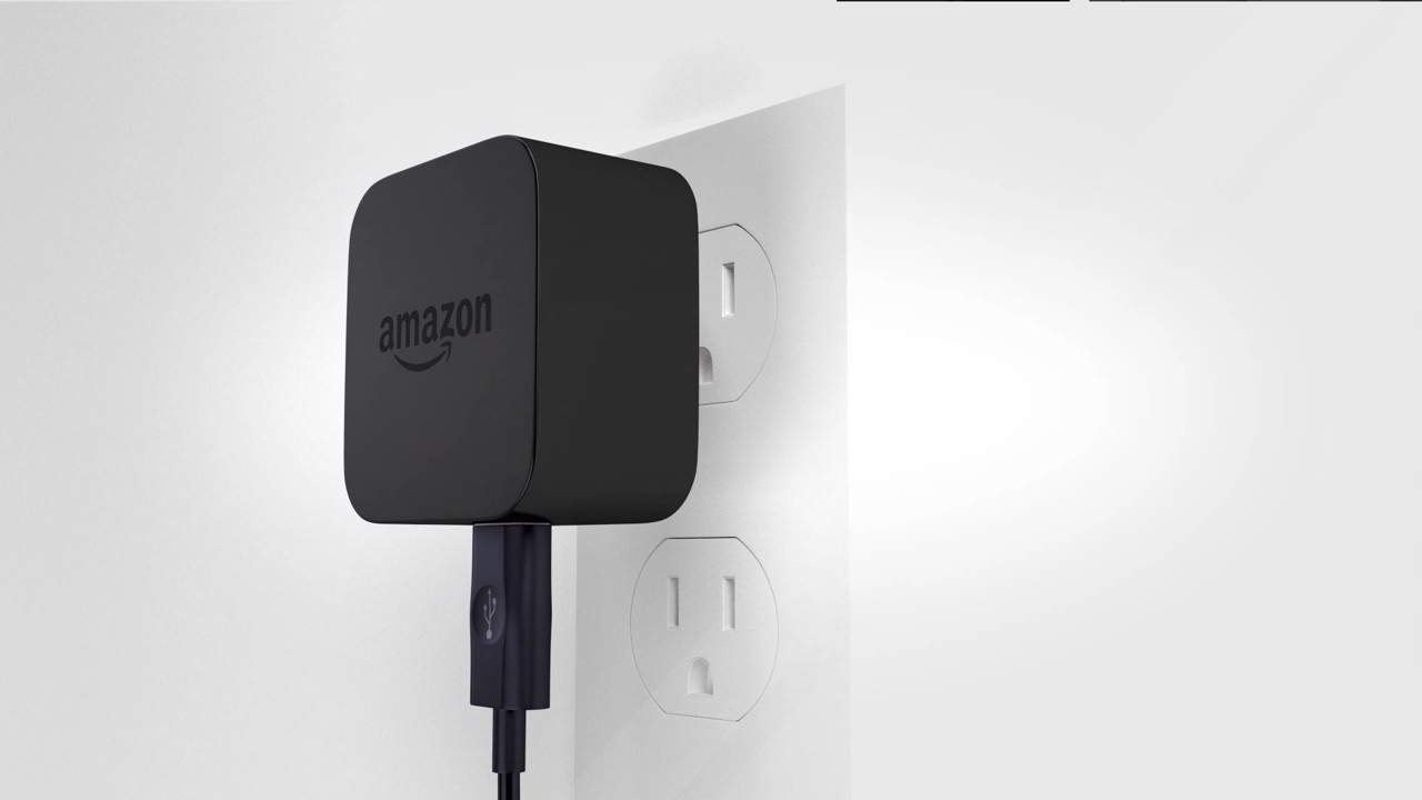 Plugging the power cable into the wall.