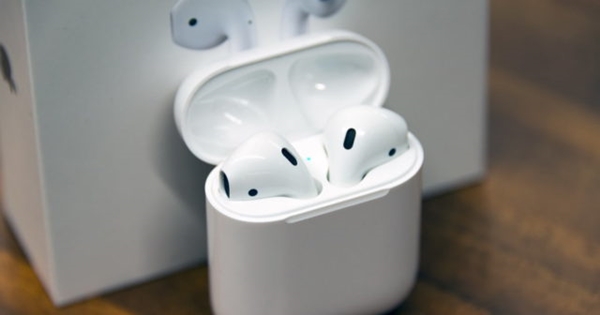 Apple AirPods in their case.