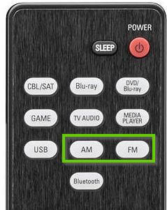 Top of denon remote showing the FM and AM buttons